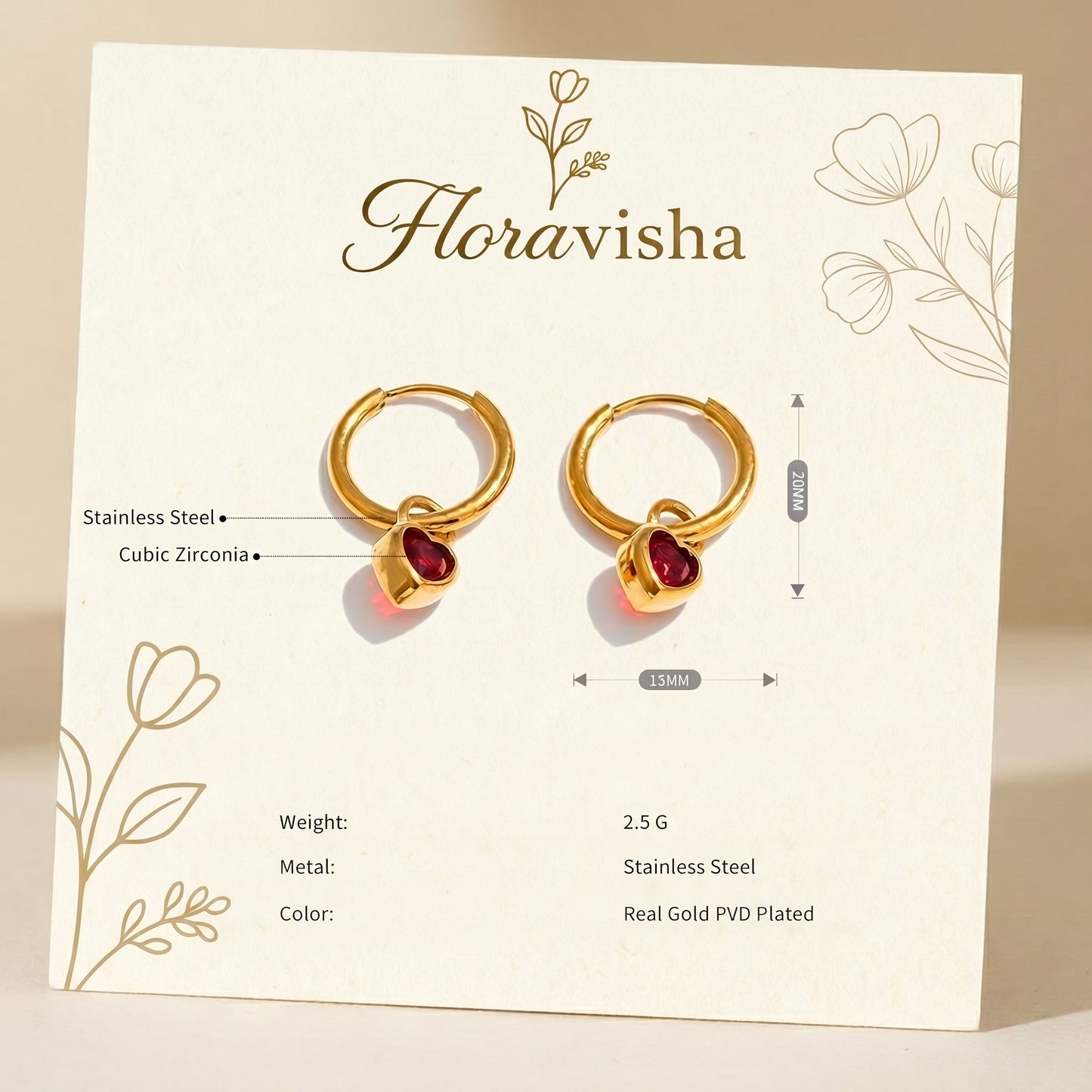 Gold hoop earrings with red heart-shaped stones on a Floravisha branded card.