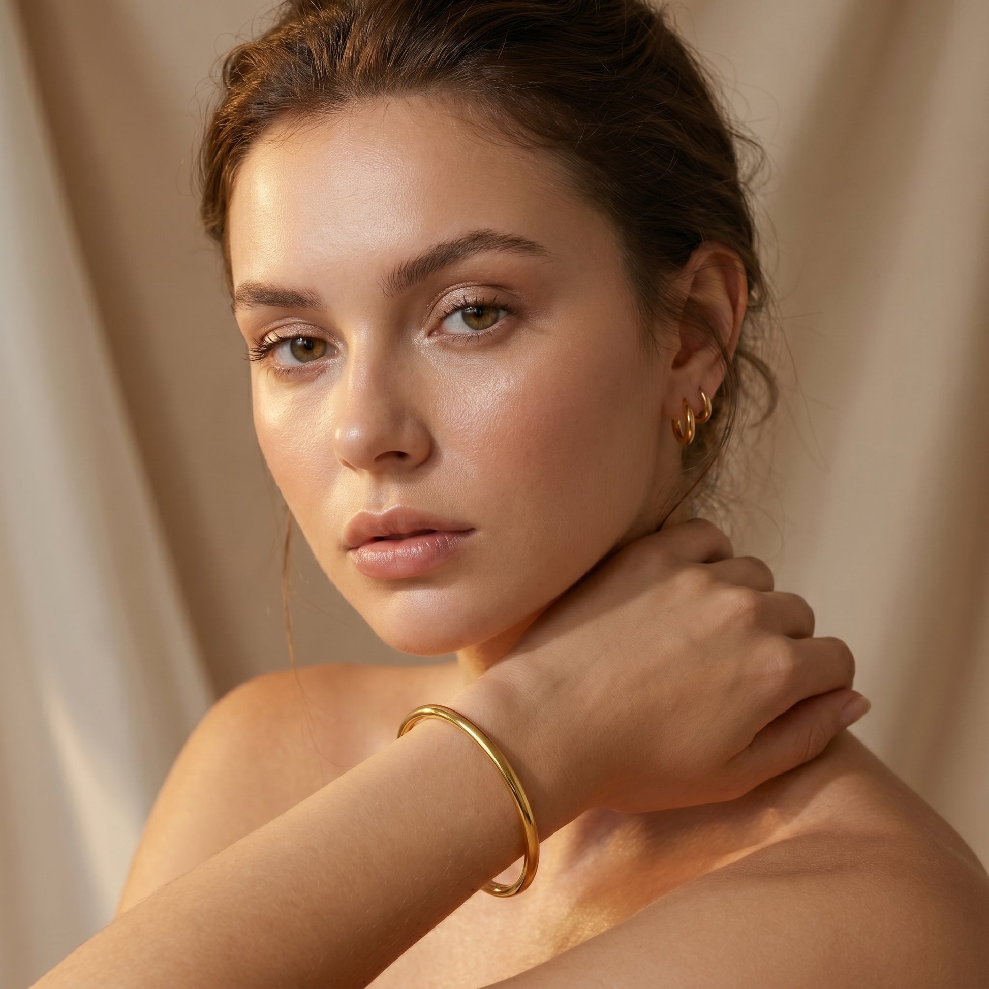 Woman wearing high quality Aura Minimalist Cuff Bangle by Floravisha against a beige background