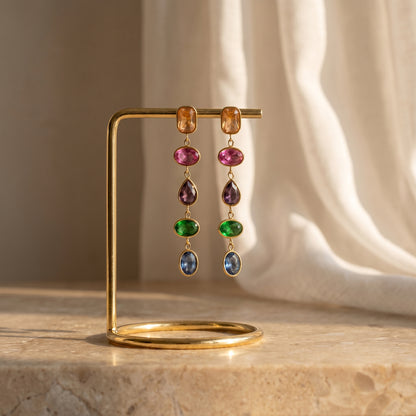 High quality waterproof gold plated cascading drop earrings featuring vibrant multi-color gemstones in champagne, ruby, amethyst, emerald, and sapphire, set against a pristine background.