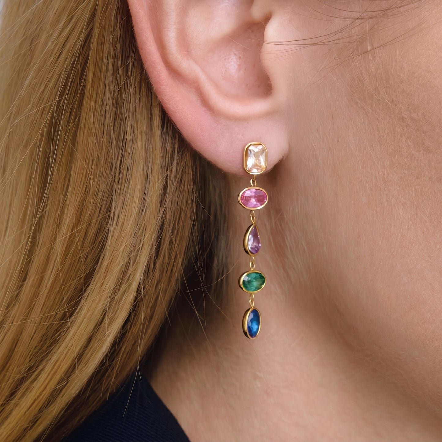 High quality waterproof gold plated cascading drop earrings featuring vibrant multi-color gemstones in champagne, ruby, amethyst, emerald, and sapphire, set against a pristine background.