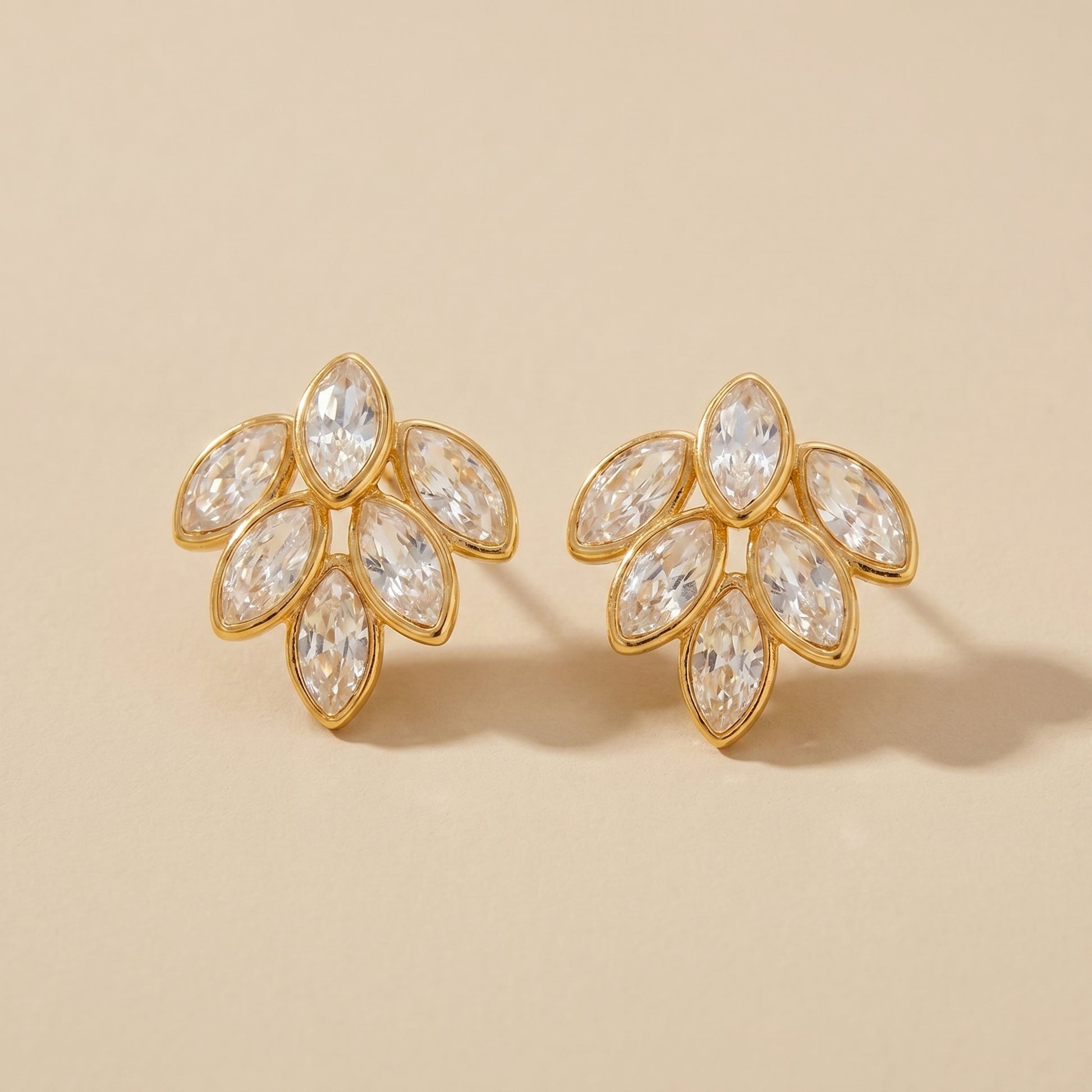 High quality waterproof gold plated stud earrings featuring a modern fan design with clear marquise-cut crystals.