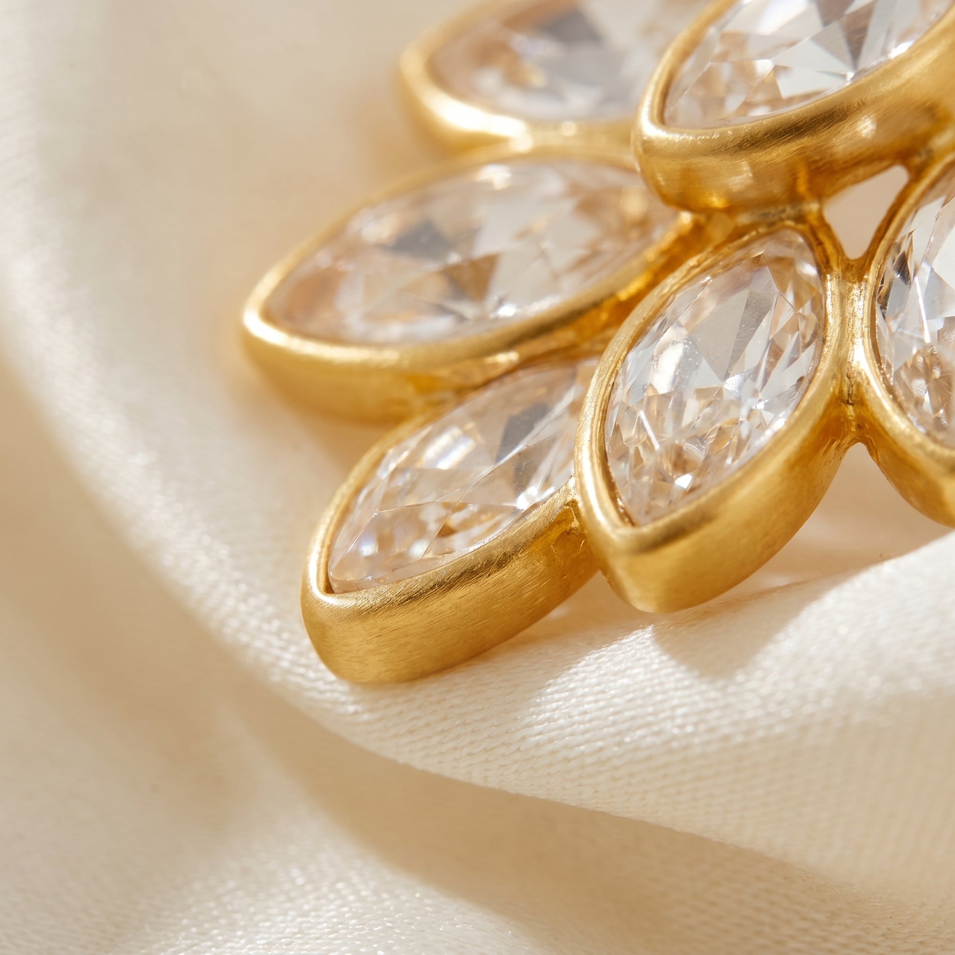High quality waterproof gold plated stud earrings featuring a modern fan design with clear marquise-cut crystals.