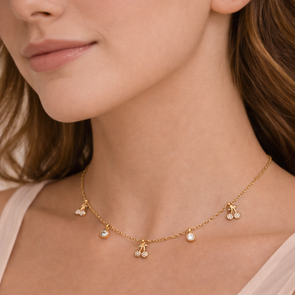 gold necklace with small pendants.