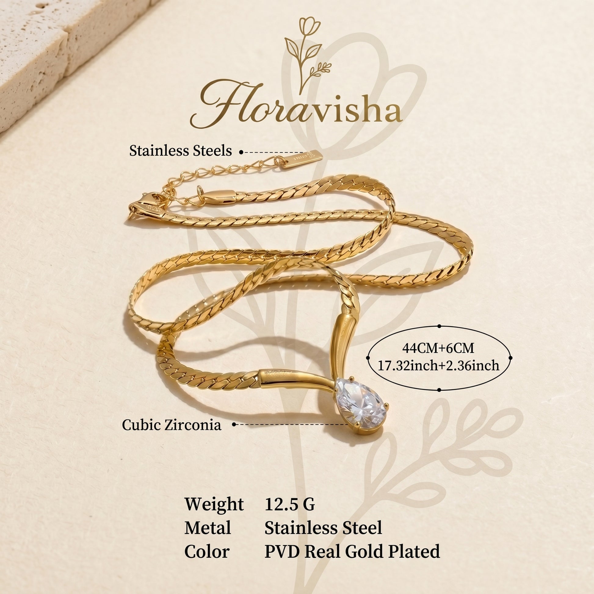 Close-up of gold snake chain necklace with sparkling teardrop zircon pendant, elegant minimalist women’s jewelry.