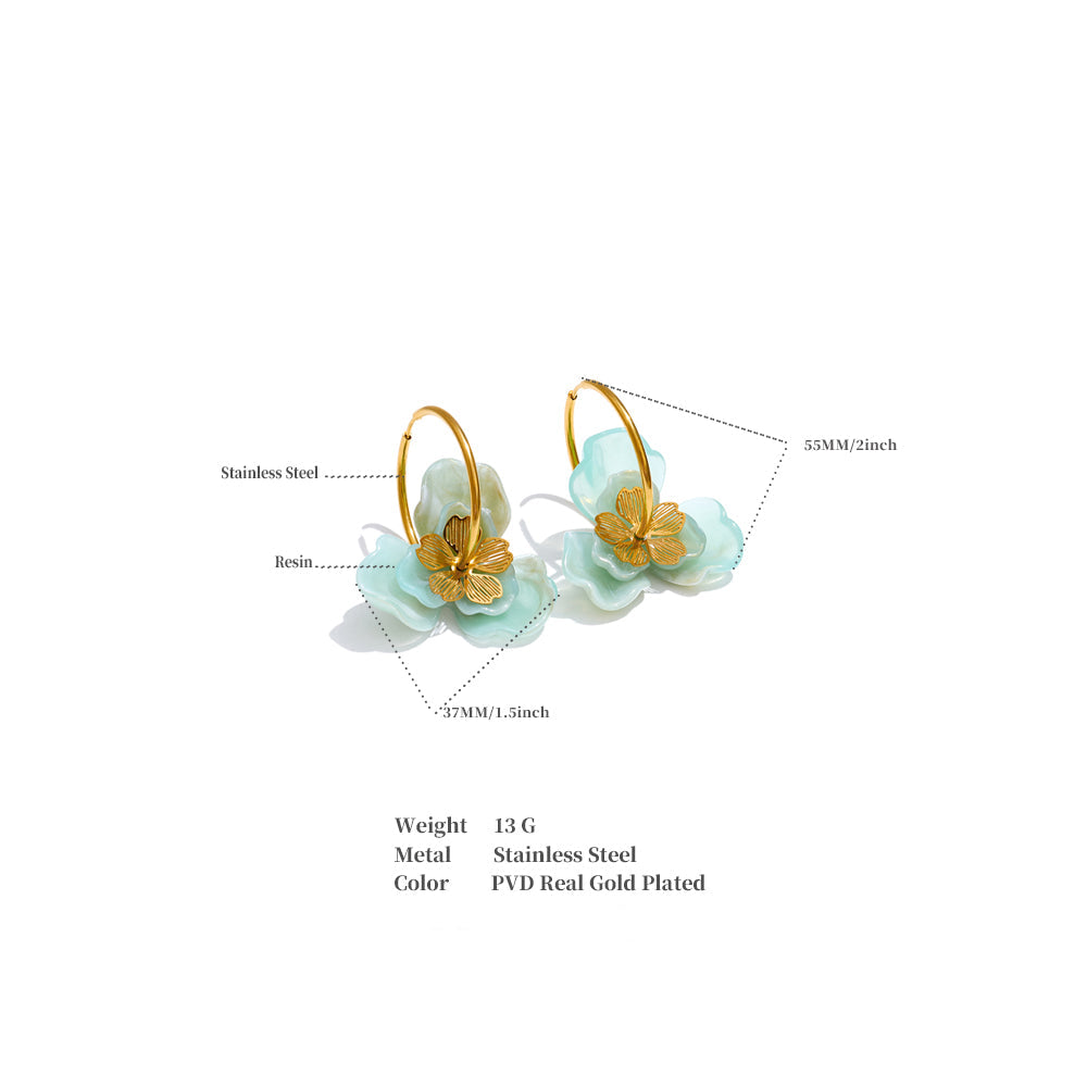 Floral earrings with gold accents on a white background. latest earring models and trending earrings models. new arrivals.