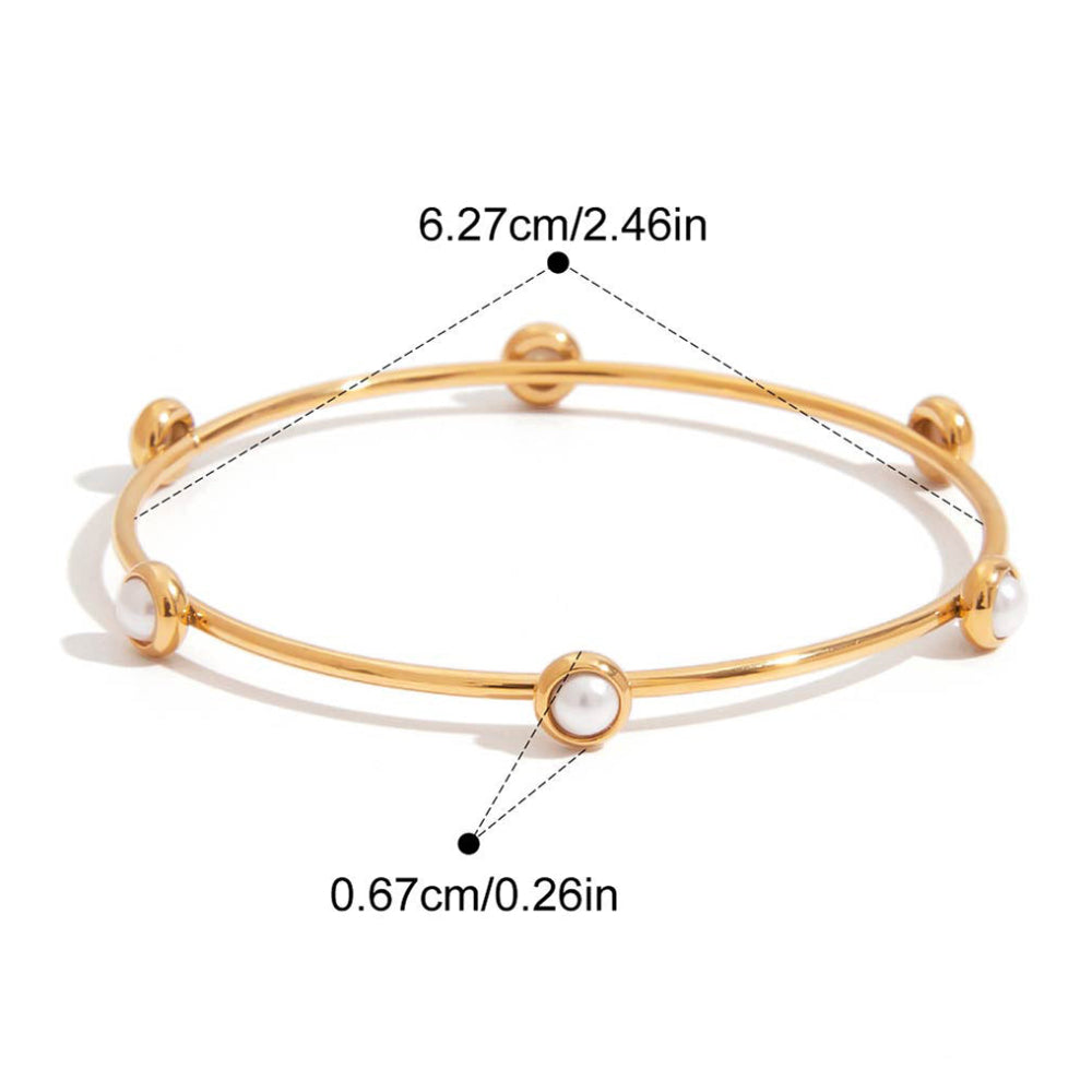 Gold bracelet with measurements and product details.