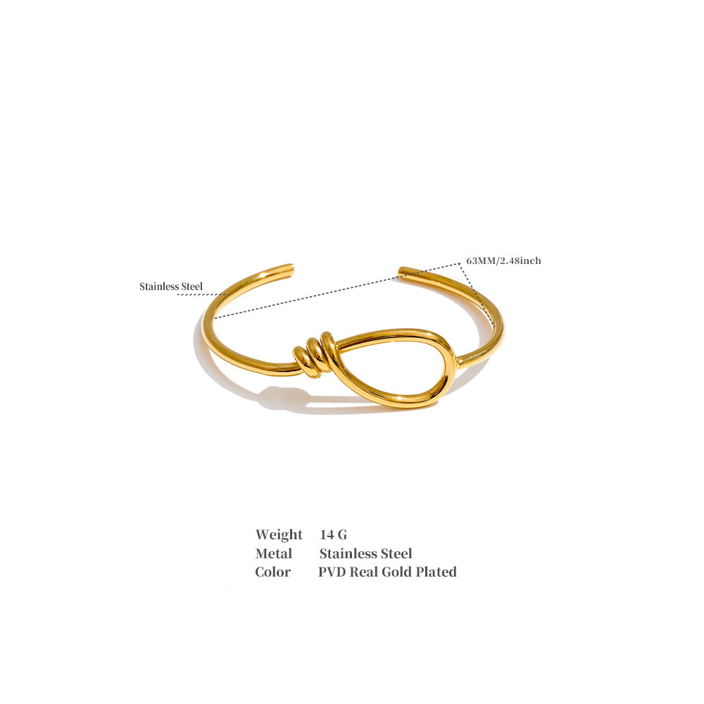 Gold open bracelet.