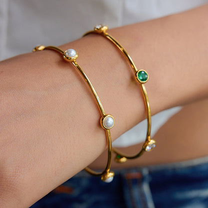 Gold bracelets with gemstones