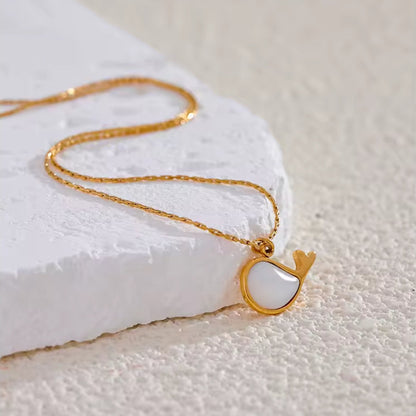 Gold necklace with a unique pendant.