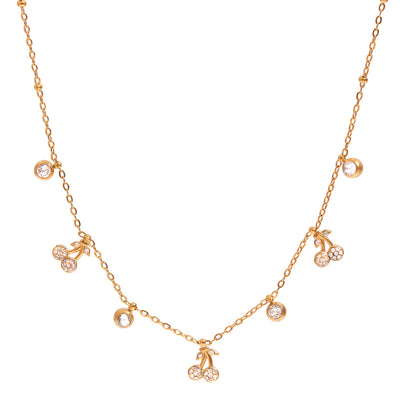 Gold necklace with cherry and gemstone pendants.