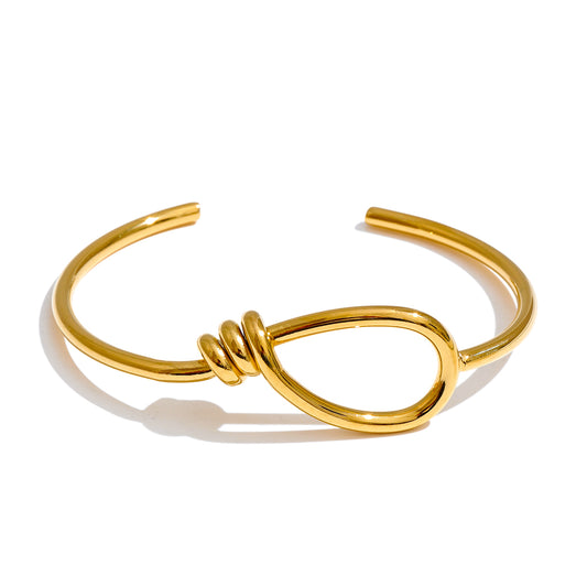 Gold open bracelet.