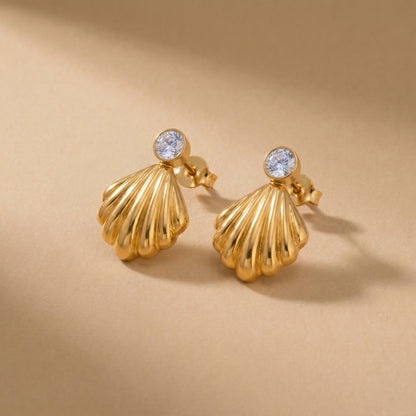 Waterproof gold-plated scallop shell drop earrings featuring a brilliant crystal stud by Floravisha. Displayed on a clean background highlighting the high-quality, skin-friendly jewelry design.