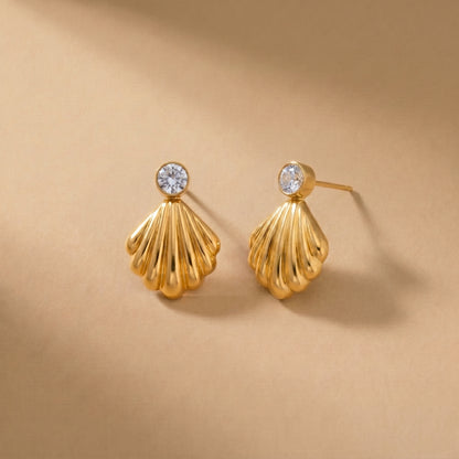 Waterproof gold-plated scallop shell drop earrings featuring a brilliant crystal stud by Floravisha. Displayed on a clean background highlighting the high-quality, skin-friendly jewelry design.