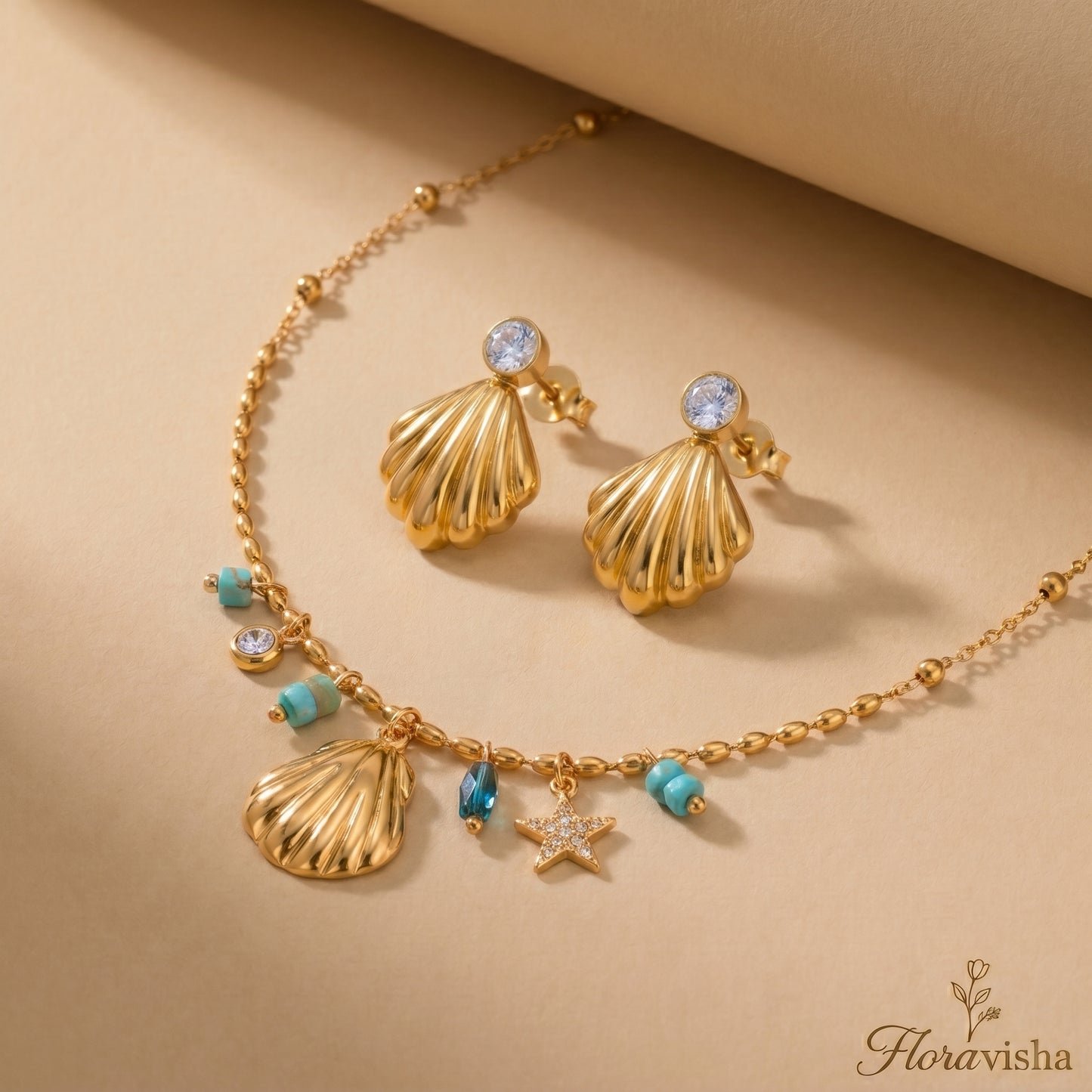 Waterproof gold-plated scallop shell drop earrings featuring a brilliant crystal stud by Floravisha. Displayed on a clean background highlighting the high-quality, skin-friendly jewelry design.