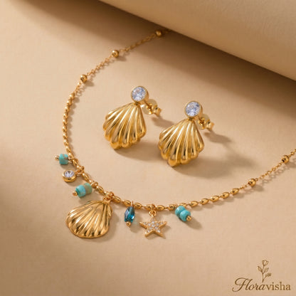 Waterproof gold-plated scallop shell drop earrings featuring a brilliant crystal stud by Floravisha. Displayed on a clean background highlighting the high-quality, skin-friendly jewelry design.
