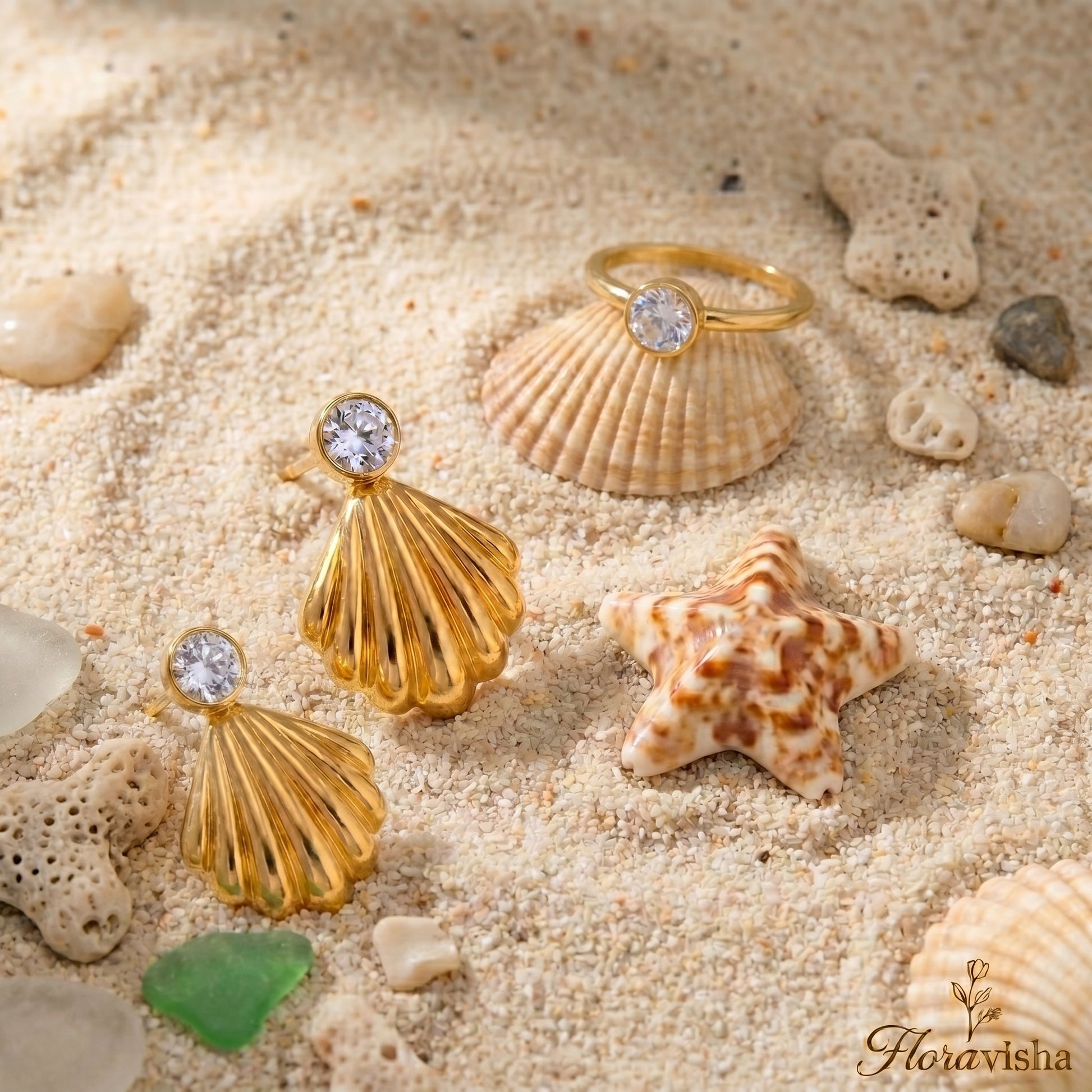 Waterproof gold-plated scallop shell drop earrings featuring a brilliant crystal stud by Floravisha. Displayed on a clean background highlighting the high-quality, skin-friendly jewelry design.
