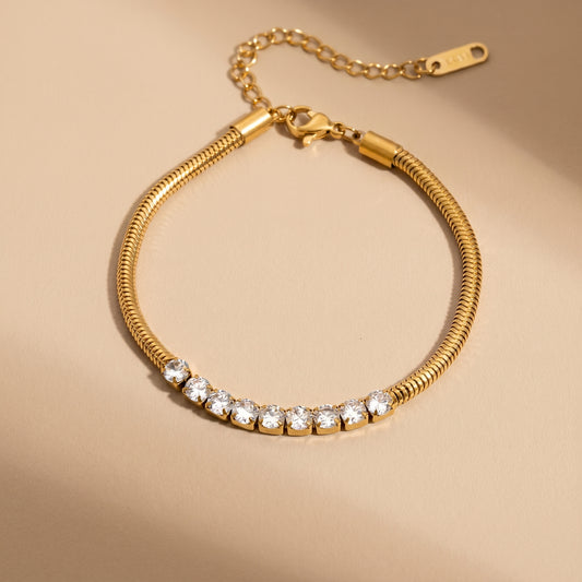 High quality waterproof gold plated snake chain bracelet featuring a row of clear crystals.