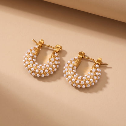 The high quality Lumina Micro Pearl Pavé Hoops by Floravisha, featuring encrusted seed pearls and gold PVD plating on a clean background.
