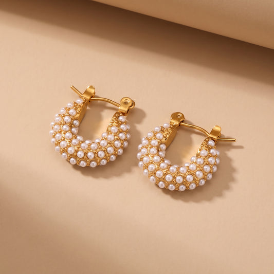 The high quality Lumina Micro Pearl Pavé Hoops by Floravisha, featuring encrusted seed pearls and gold PVD plating on a clean background.