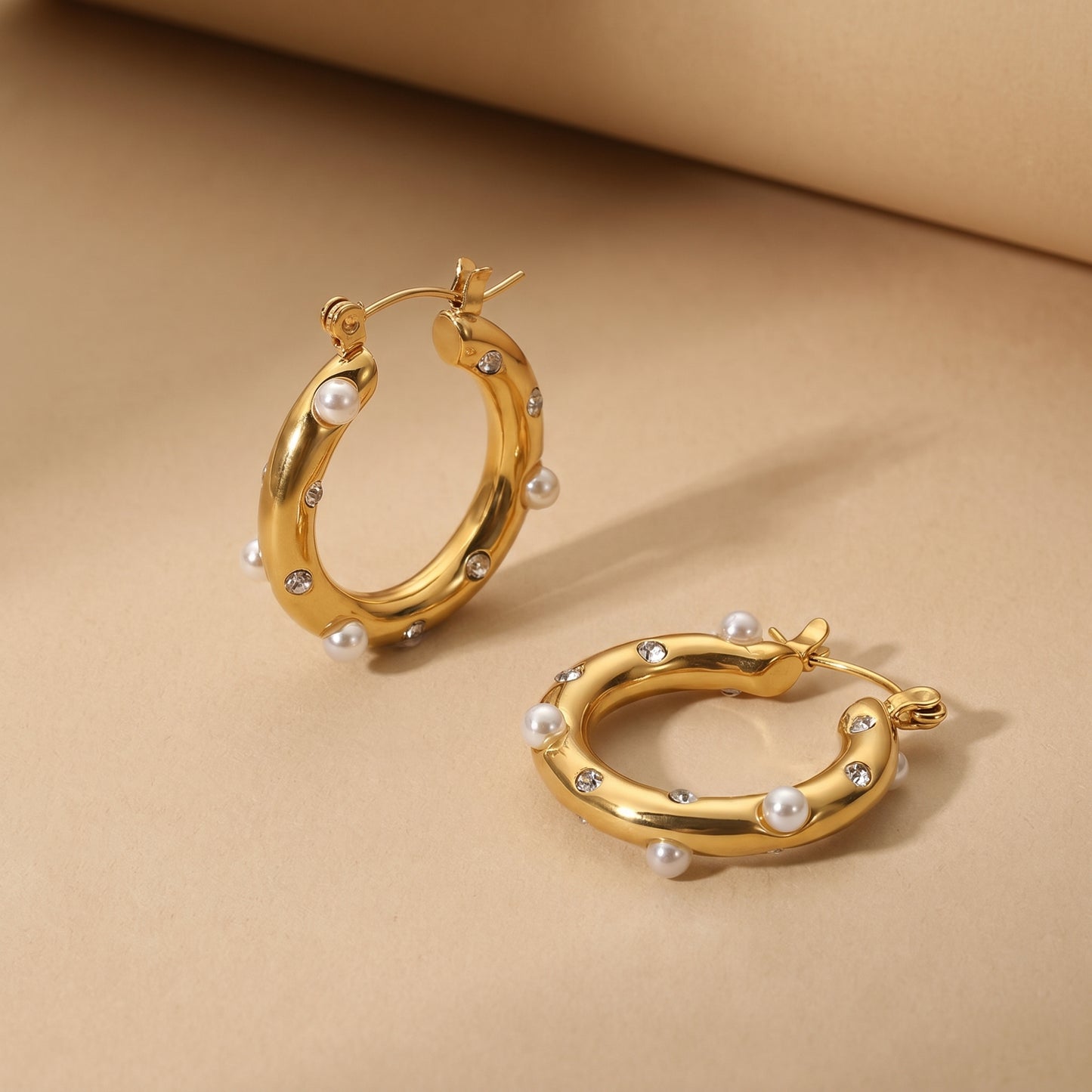High quality waterproof gold plated chunky hoop earrings featuring scattered pearls and inset crystals.