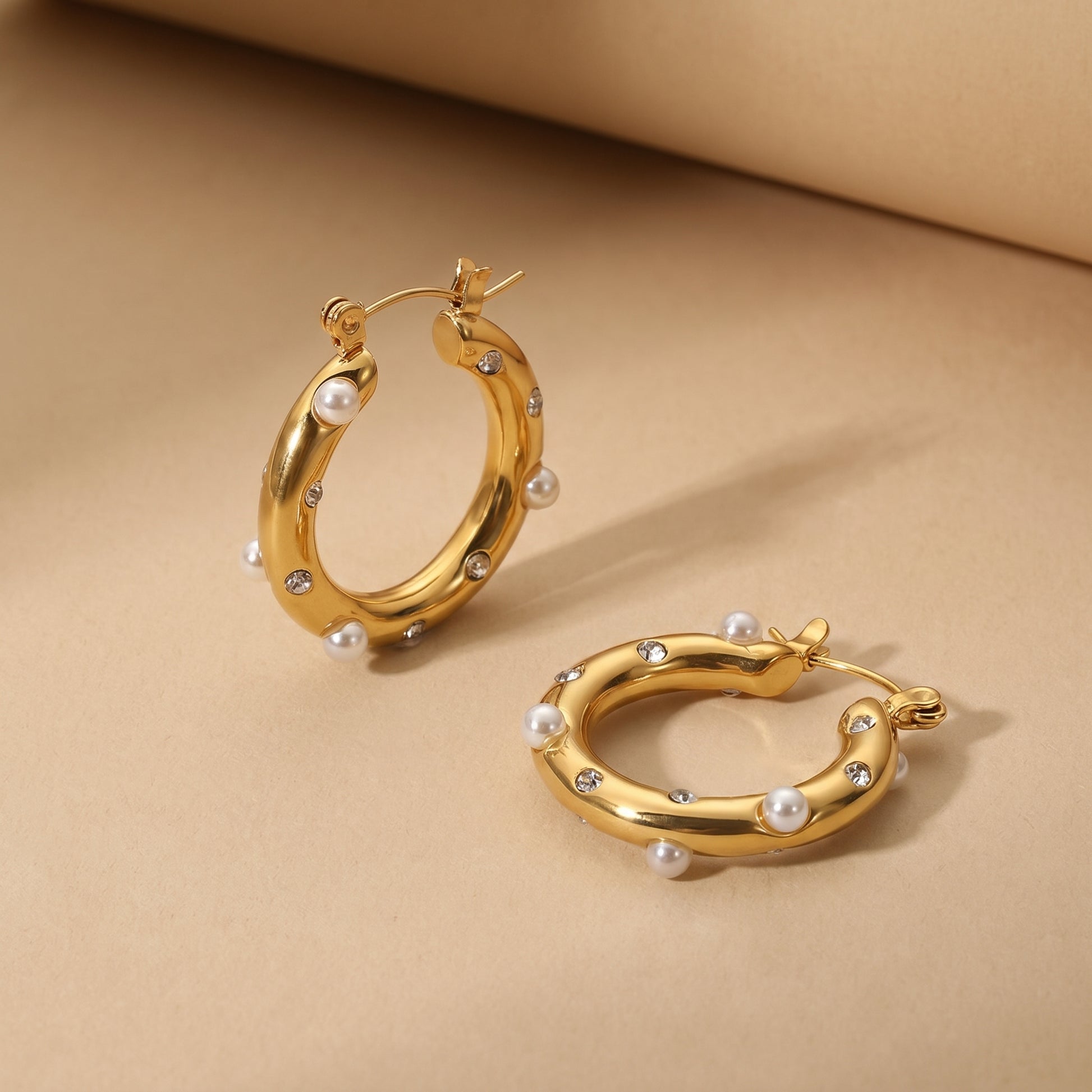 High quality waterproof gold plated chunky hoop earrings featuring scattered pearls and inset crystals.