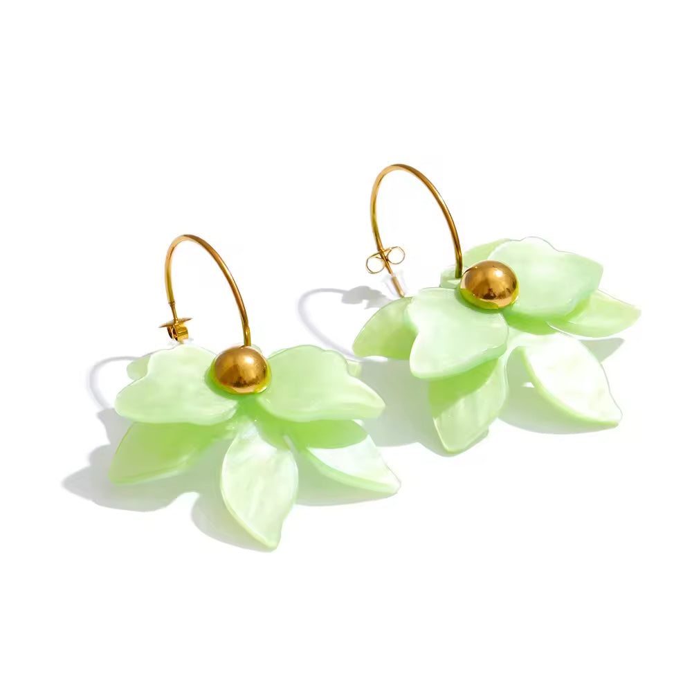 Pair of light green flower-shaped earrings with gold beads on a white background. latest earring models and trending earrings models. new arrivals.
