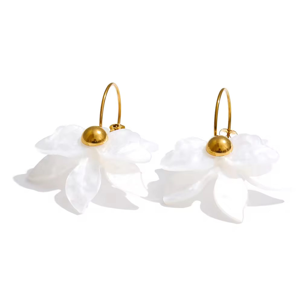 Pair of white floral earrings with gold accents on a white background. latest earring models and trending earrings models. new arrivals.