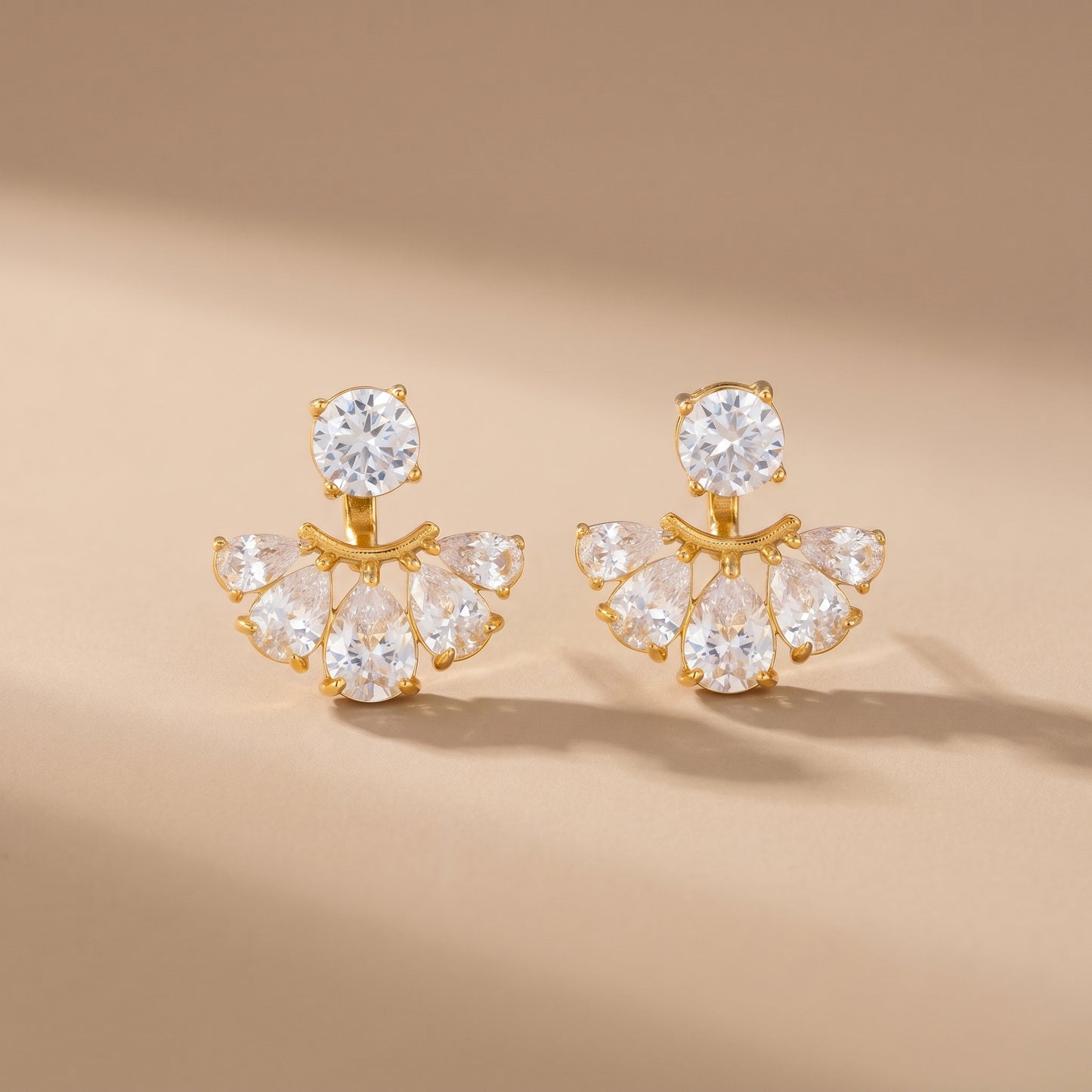 High quality waterproof gold plated 2-in-1 convertible fan earrings featuring a round solitaire stud and an interchangeable fanned crescent of clear crystals, on a clean background.