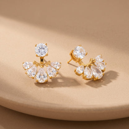 High quality waterproof gold plated 2-in-1 convertible fan earrings featuring a round solitaire stud and an interchangeable fanned crescent of clear crystals, on a beige background.