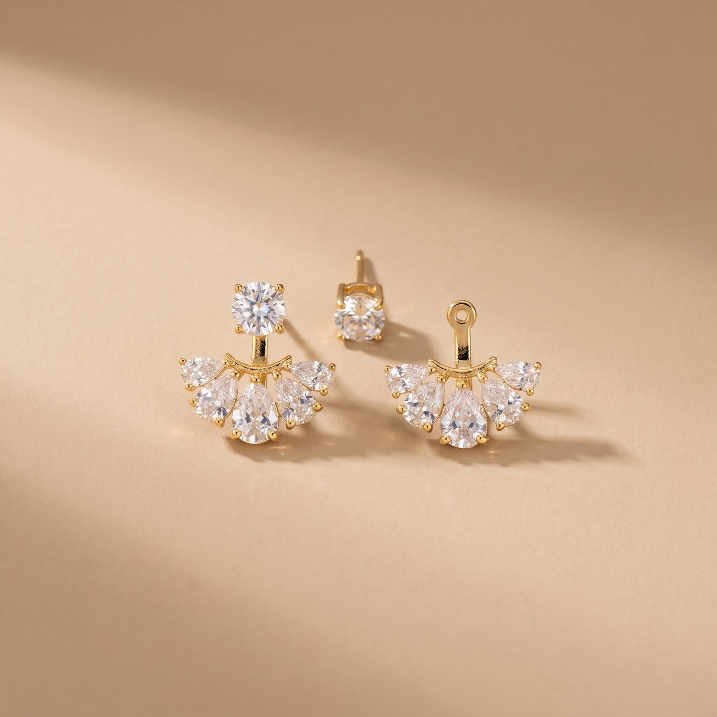 High quality waterproof gold plated 2-in-1 convertible fan earrings featuring a round solitaire stud and an interchangeable fanned crescent of clear crystals, on a clean white background.
