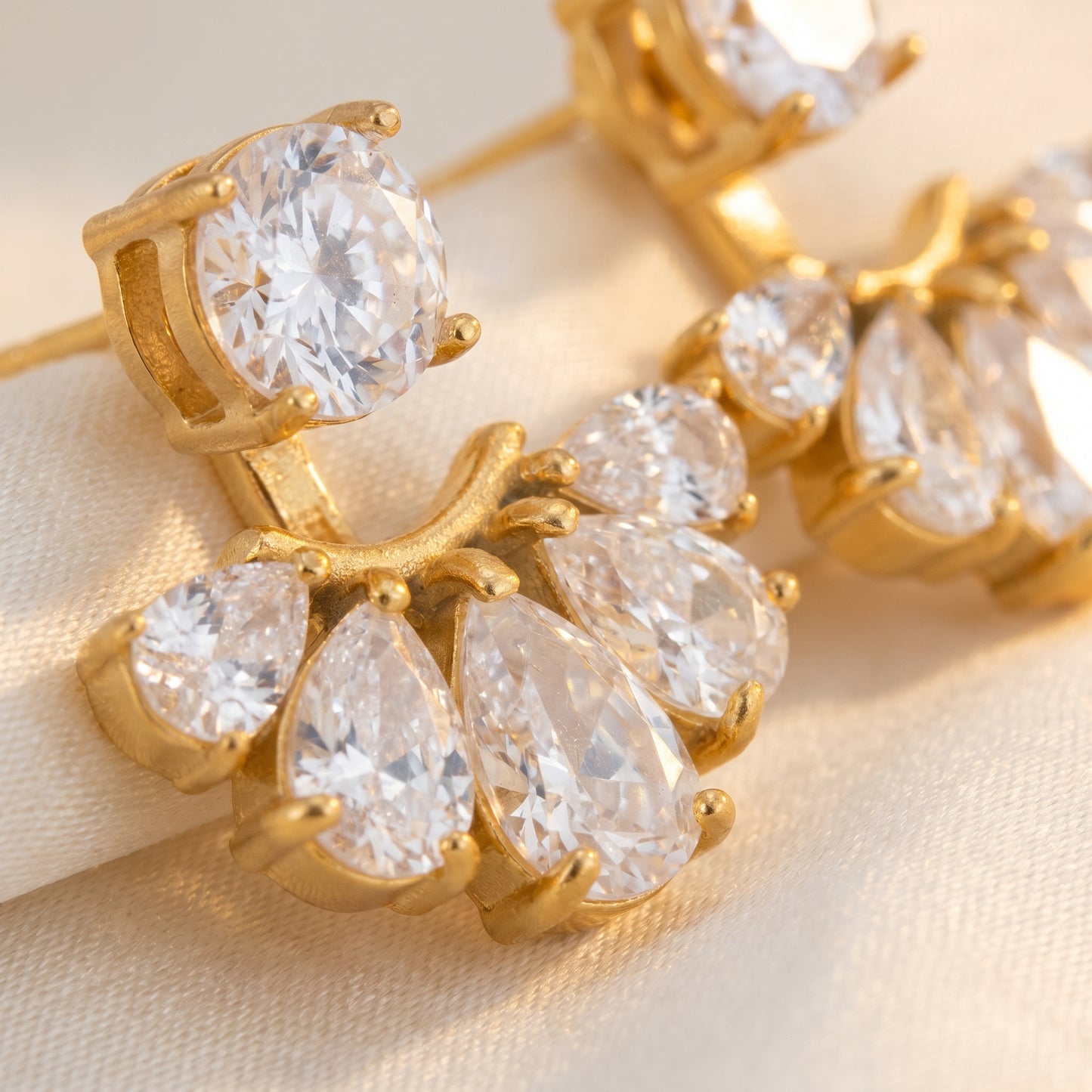 High quality waterproof gold plated 2-in-1 convertible fan earrings featuring a round solitaire stud and an interchangeable fanned crescent of clear crystals, on a clean white background.