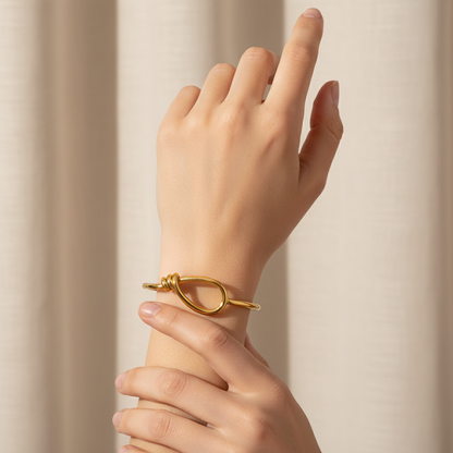 Gold open bracelet.