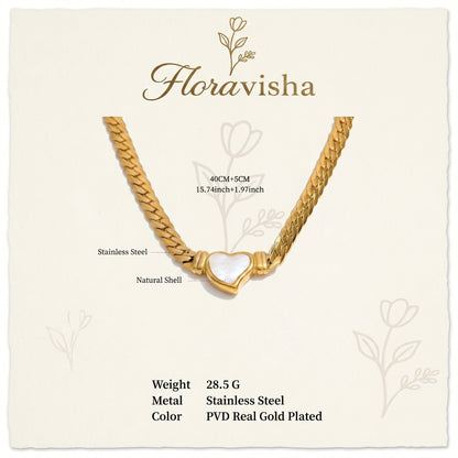 gold snake chain heart pendant necklace on neutral background minimalist luxury jewelry details