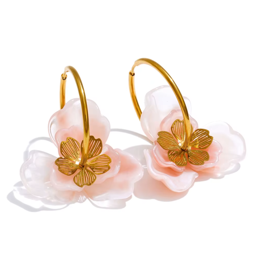 Pair of floral hoop earrings with gold accents on a white background. latest earring models and trending earrings models. new arrivals.